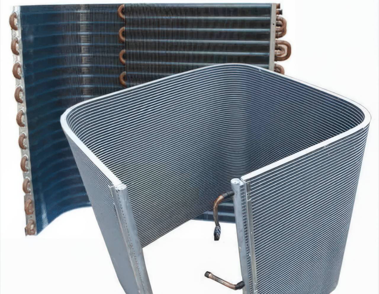 Curved gray condenser coil with dense metal fins beside flat rectangular coil unit showing copper refrigerant tubes on white background.