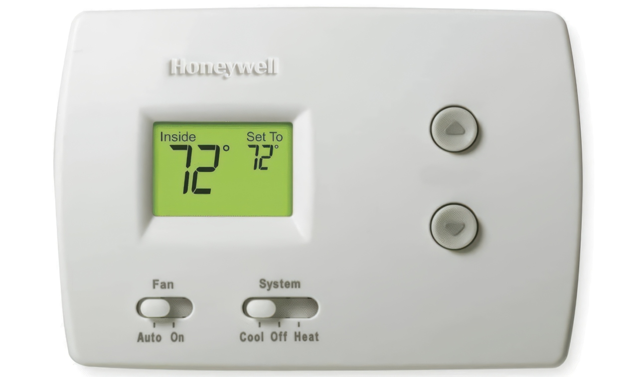 This Honeywell digital thermostat features a green backlit display set to 72 degrees with manual sliding controls at the bottom.