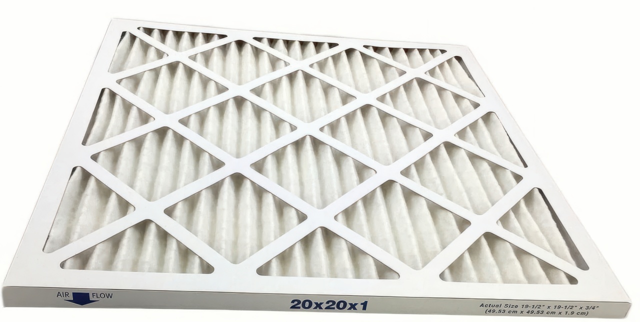 This professional photograph shows a white pleated HVAC filter with a cardboard lattice frame on a clean white background. Blue text on the side indicates air flow direction and size measurements including 19 and a half inches.