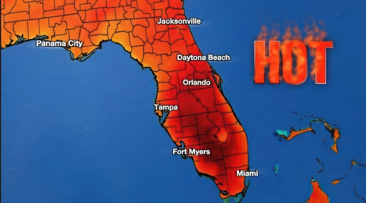 This digital graphic shows the state of Florida highlighted in intense red and orange shades to indicate extreme temperatures. The labels for major cities like Miami and Orlando appear alongside a large red HOT text overlay decorated with flames.